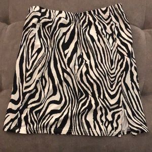Zebra animal miniskirt with 4” slit.  Never worn